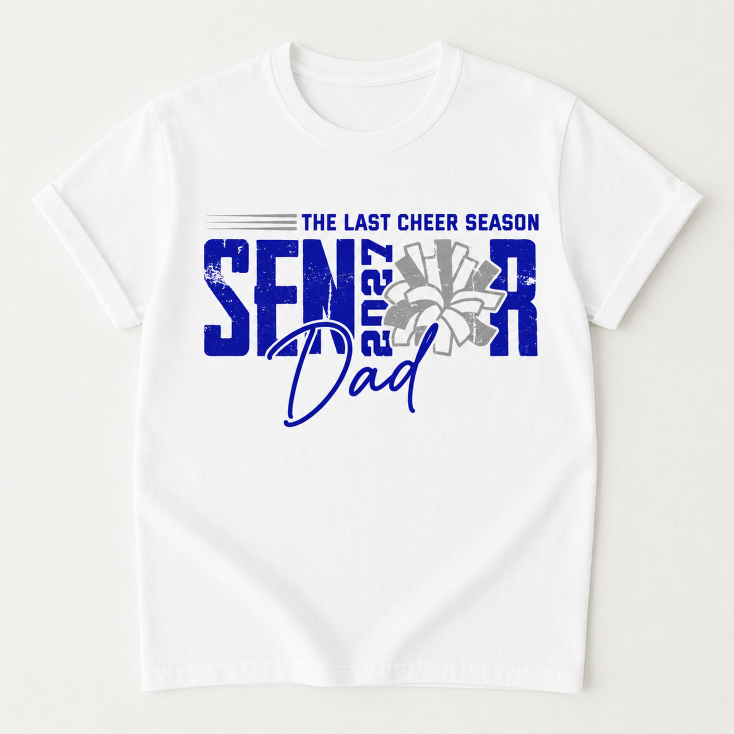 A white short-sleeve crewneck t-shirt with a blue and gray graphic on the front that reads 'THE LAST CHEER SEASON SENIOR 2027 Dad' with a stylized flower and star details.