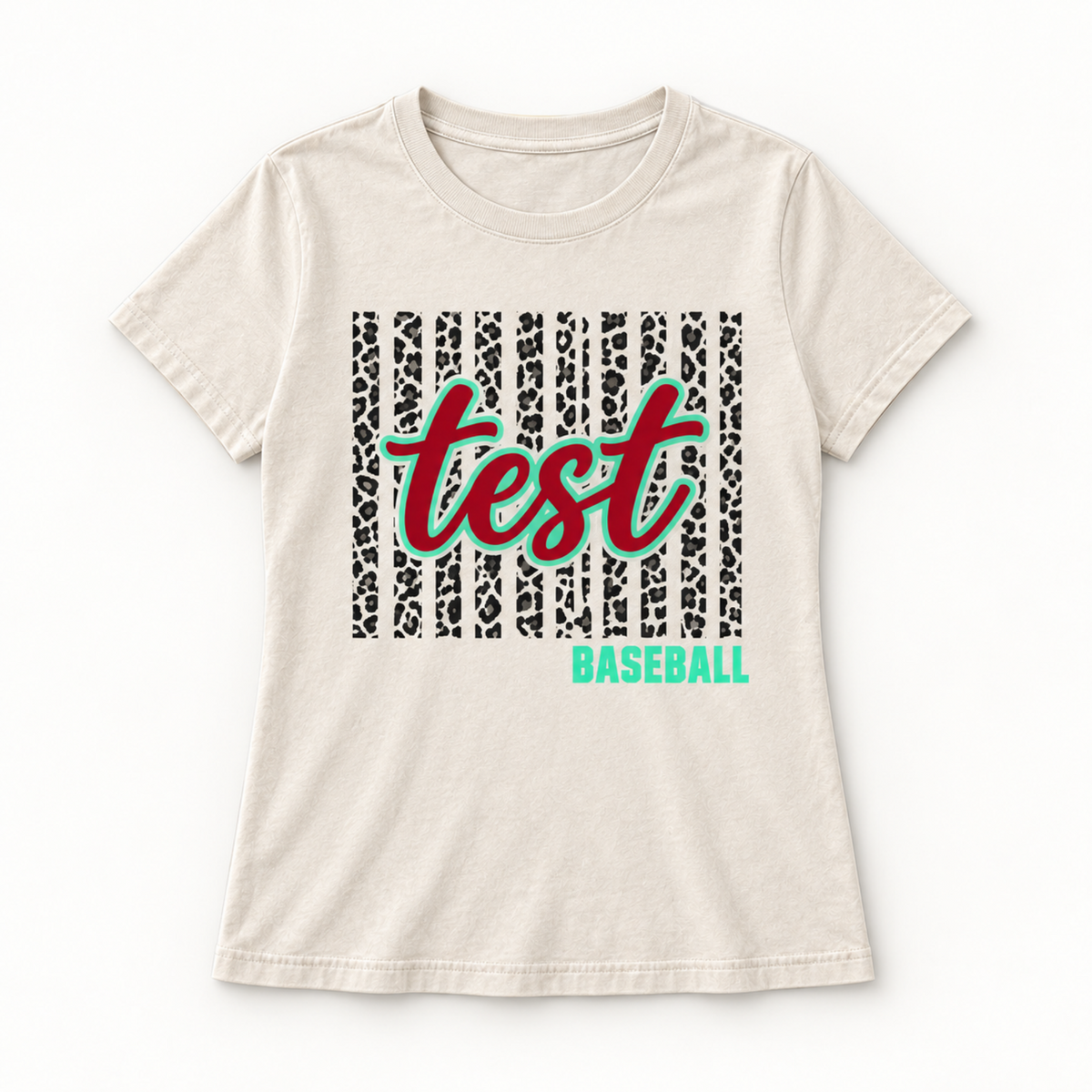 An off-white short-sleeve t-shirt with a custom graphic print featuring a black leopard print background, the word 'test' in red script with a green outline, and the word 'BASEBALL' in green below it.