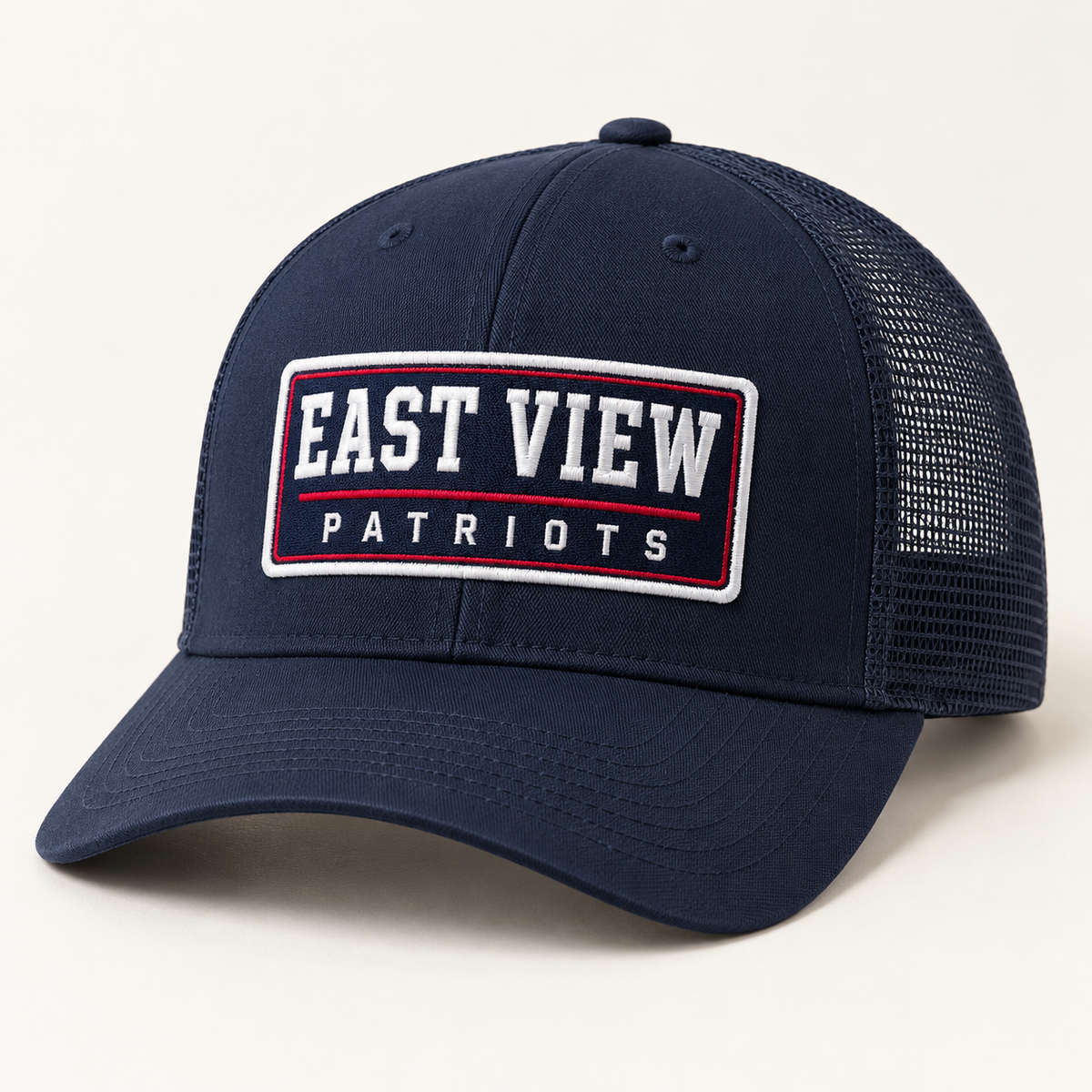 Navy trucker hat with rectangular East View Patriots embroidered patch in red and white