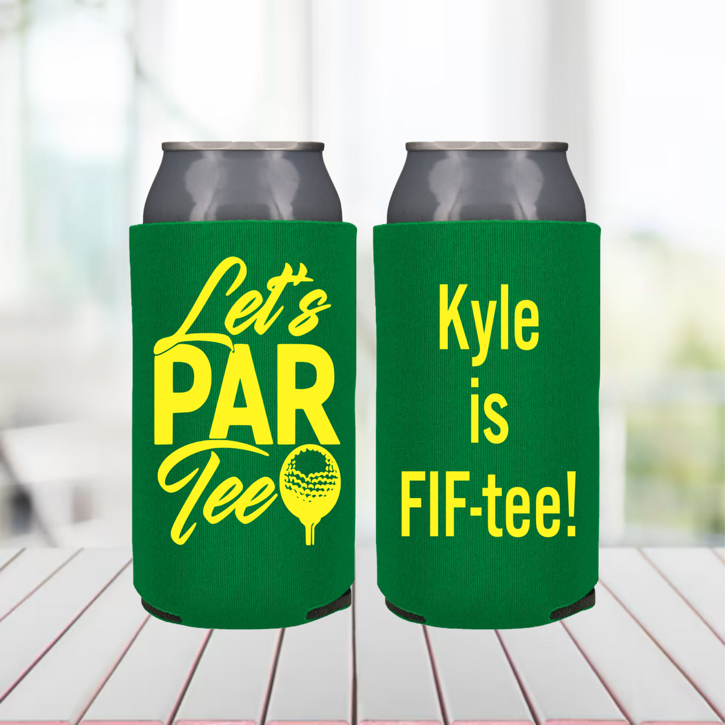 Two green can coolers with yellow text on a blurred background