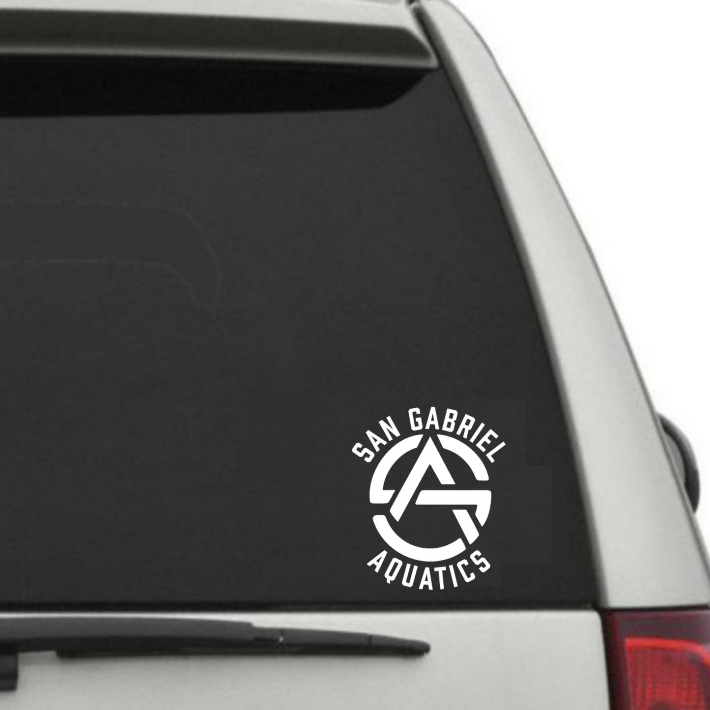 Car window with a 'San Gabriel Aquatics' decal on a white background