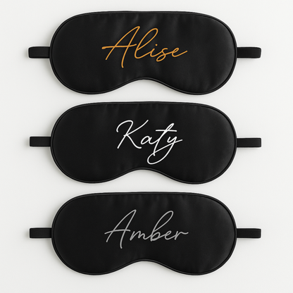 Three black sleep masks with printed names 'Alise', 'Katy', and 'Amber' on a white background.
