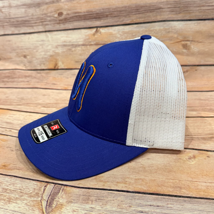 Blue and white baseball cap with a logo on a wooden surface