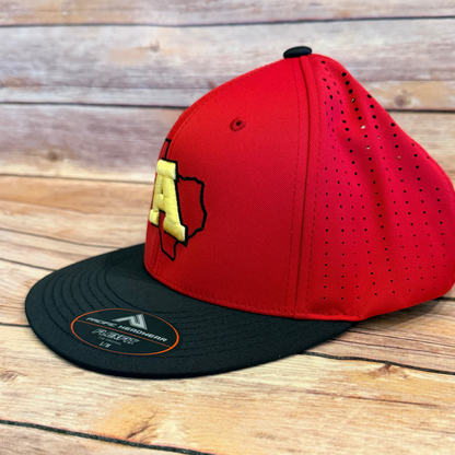 Red and black cap with a logo on a wooden surface