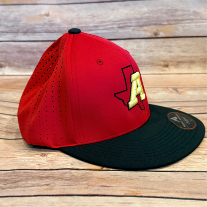 Red and black baseball cap with a logo on a wooden surface