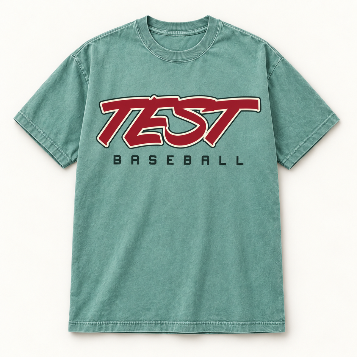 A washed teal-green short-sleeve t-shirt with a graphic on the chest reading 'TEST' in red with a white outline and 'BASEBALL' printed underneath in black.