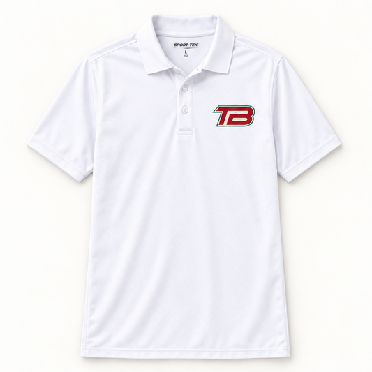 A white short-sleeve polo shirt with a collar and a three-button placket, featuring a red and black 'TB' logo on the left chest. The brand 'SPORT-TEK' is visible on the inner neck label.