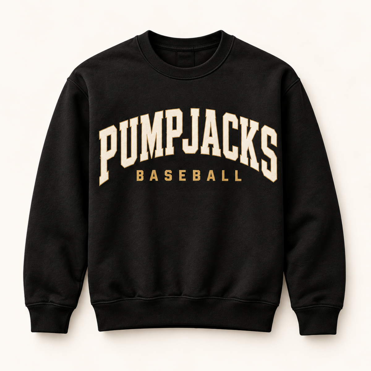 A black crewneck sweatshirt with 'PUMPJACKS BASEBALL' printed in cream and gold varsity-style lettering on the front, displayed against a light cream background.