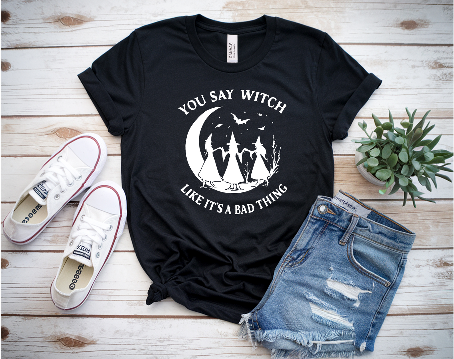 Black witch graphic T-shirt with vintage design of three witches dancing under the moon and bats — Halloween shirt