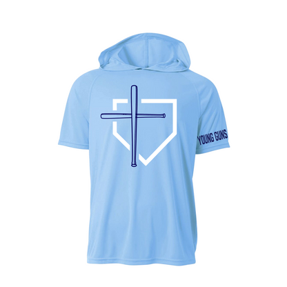 A light blue short-sleeve hooded shirt shown from the back, featuring a large white home plate outline with a dark blue cross and baseball bat graphic in the center, and the words 'YOUNG GUNS' printed in dark blue on the right sleeve.
