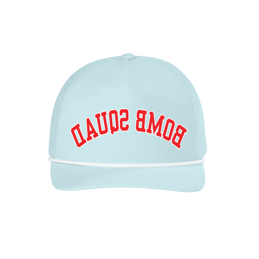 A light blue baseball cap with 'BOMB SQUAD' embroidered in red arched lettering on the front, set against a plain white background.