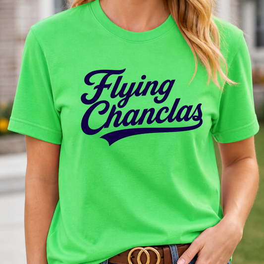 Person wearing a bright green t-shirt with 'Flying Chanclas' text, standing outdoors.