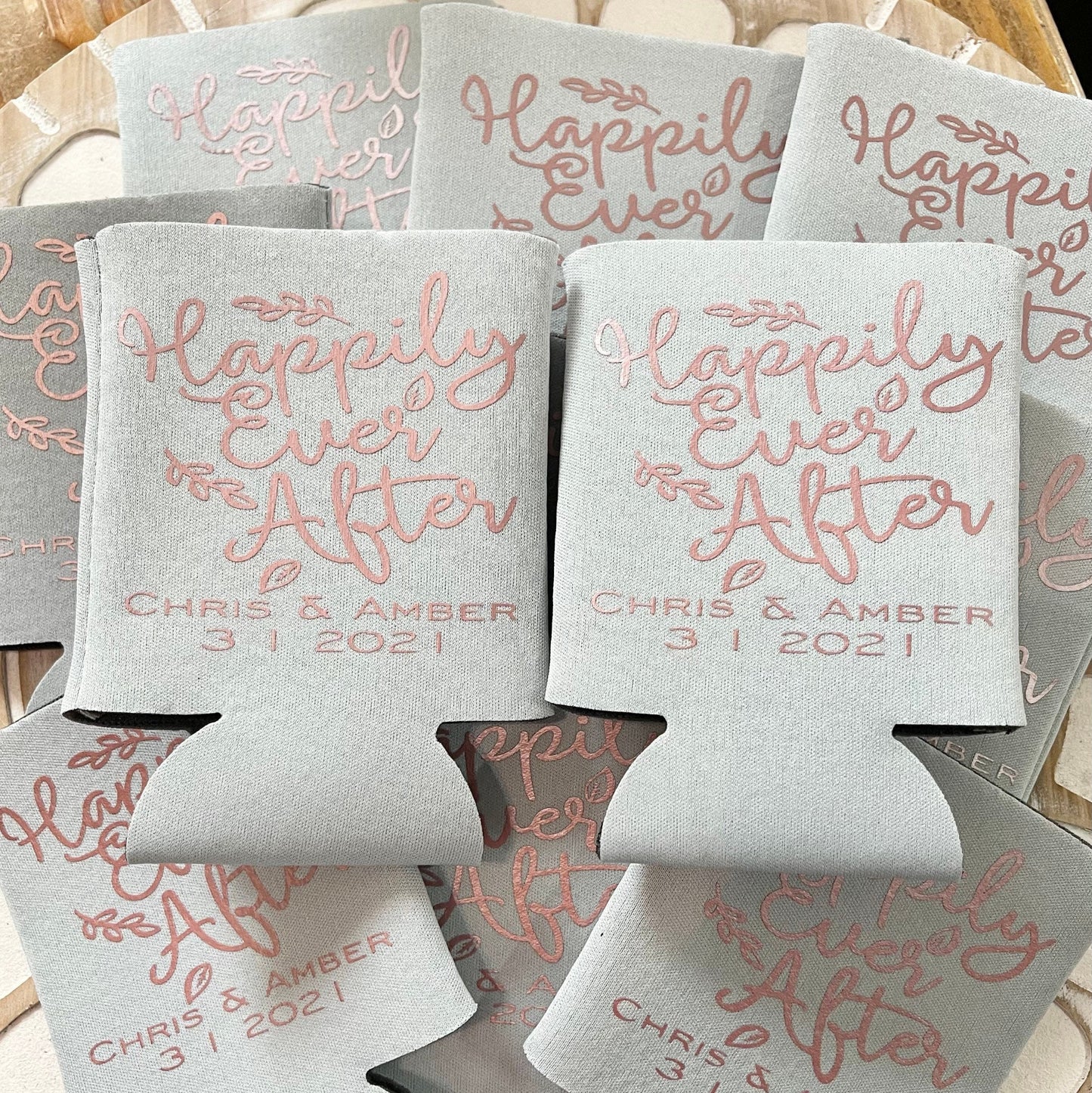 Gray can coolers with 'Happily Ever After' text and personalized names and date.