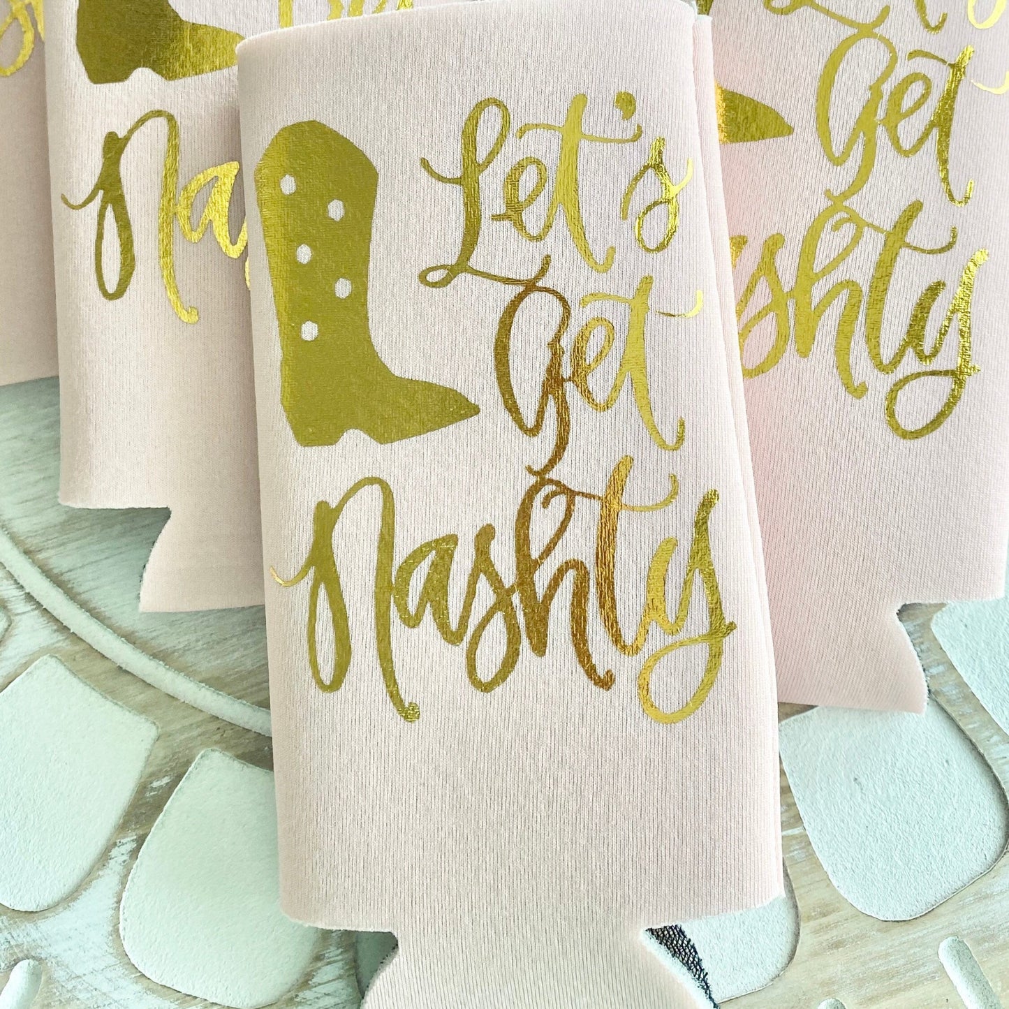 Koozies with 'Let's Get Nashty' text and boot design 