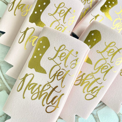 Koozies with gold text on a light background