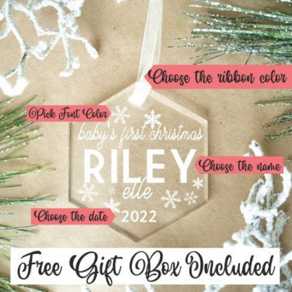 Personalized baby's first Christmas ornament with customizable text on a decorative background.