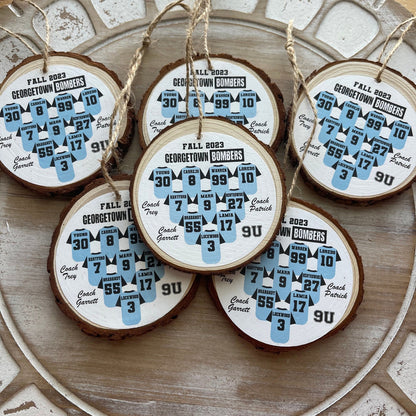 Wooden ornaments with printed designs on a decorative plate