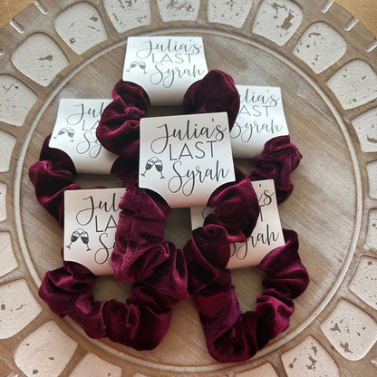 Wine Velvet scrunchies on a decorative plate with 'Julia's Last Syrah' cards.
