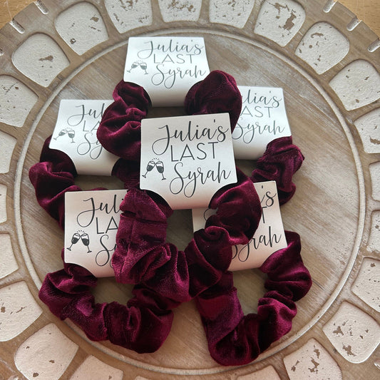 Wine Velvet scrunchies on a decorative plate with 'Julia's Last Syrah' cards.