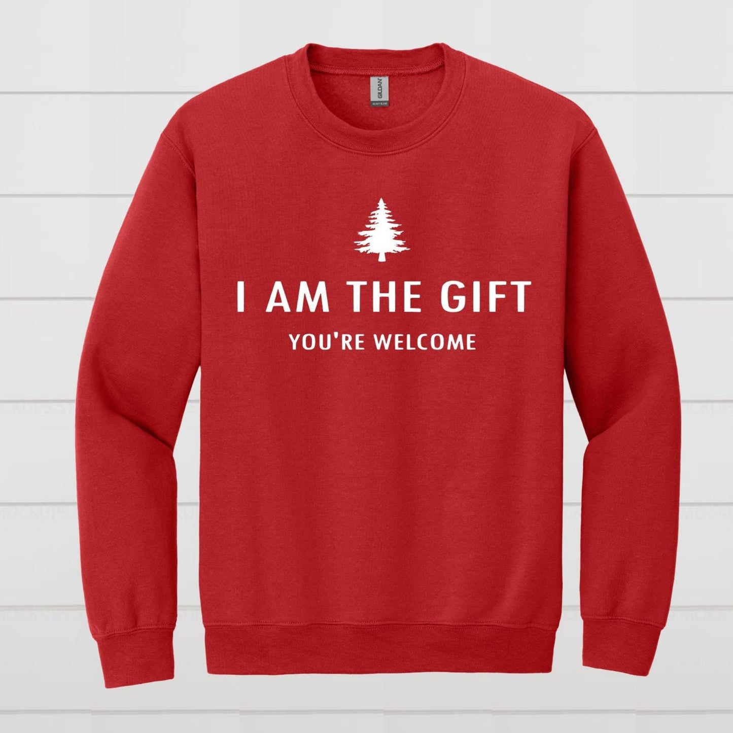 Red sweatshirt with white text and a tree graphic on a white wooden background