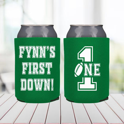 Two green can coolers with text on a blurred background