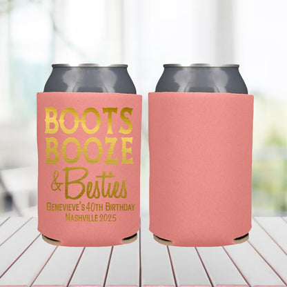 Two pink can coolers with gold text on a blurred background