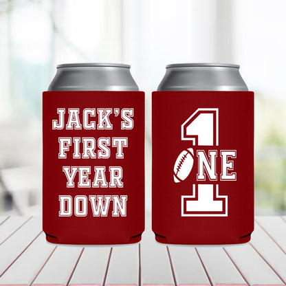Two red can coolers with white text on a blurred background