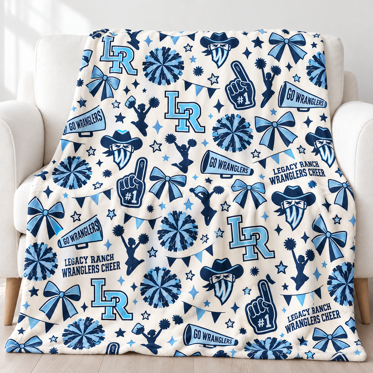 Legacy Ranch Wranglers Cheer blanket with navy and light-blue cheer icons and team logos on an ivory background