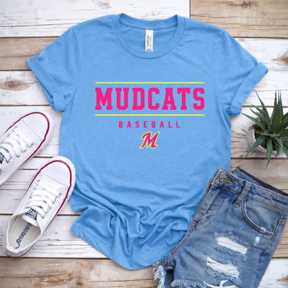 Blue t-shirt with 'MUDCATS BASEBALL' text, white sneakers, and denim shorts on a wooden surface.