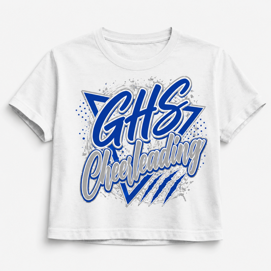A white short-sleeve crop top t-shirt featuring a blue and gray graphic print that reads 'GHS Cheerleading' with star and stripe details, shown on a light gray background.