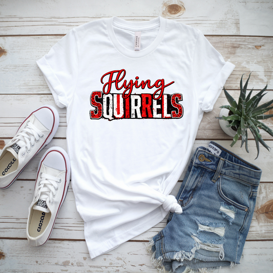 White t-shirt with 'Flying Squirrels' design, white sneakers, and denim shorts on a wooden surface.